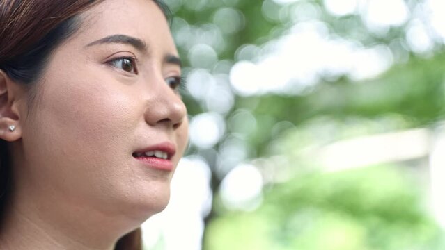 Stressed young asian woman continued speak vents negative emotions gossips complains loses her temper talks rudely talks loudly and is upset shows conflict extreme aggression.
