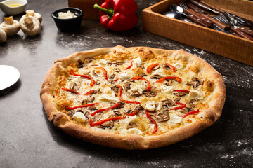 Field Mushroom Pizza with Bell pepper isolated on dark background with raw food top view of italian fastfood appetizer