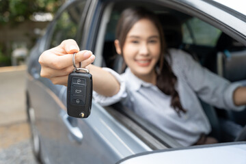 lease, rental car, sell, buy. Dealership manager send car keys to the new owner.  Sales, loan...