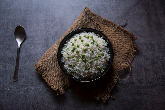 Green peas pulao made from Basmati rice served in a bowl. 