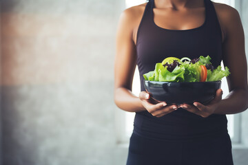 Woman Holding a Bowl of Fresh Mixed Salad. Healthy Eating and Lifestyle Concept