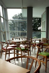 colorful wooden chairs on the balcony with city views