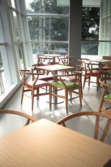 colorful wooden chairs on the balcony with city views