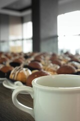 rows of snacks at night can be seen with cups in the foreground