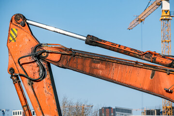 A fragment of an excavator boom on a winter day
