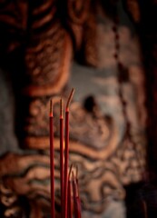 Burning prayer sticks fill the room as smoke billows from the prayer room during Chinese New Year...