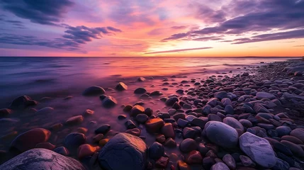 Selbstklebende Fototapete Bereich Sea stone shore, rocky surface, sunset with colorful sky over the sea
