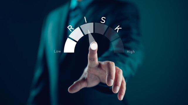 Businessman showing risk level indicator rating since low to high for risk management and assessment review concept. Business and finance concept, CEO manager management.
