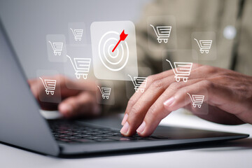 Targeting to increasing sales in ecommerce business. Person use laptop with target and shopping...