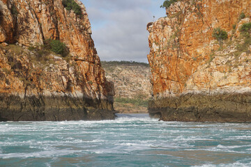 High tide water mark along the rock walls.
