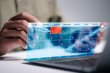Appointment reminders and meeting agenda on calendar. Person use laptop with calendar on virtual...