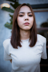 Fototapeta premium Portrait of beautiful unique confident Asian female looking at camera, close up of good looking smart and attractive positive woman, fashionable and charming young adult, diversity and multi-ethnic.