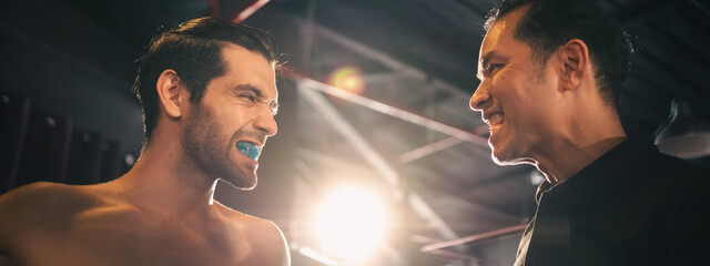 Active, athletes and fit men kick boxing and doing sport training workout in a gym. Two male...