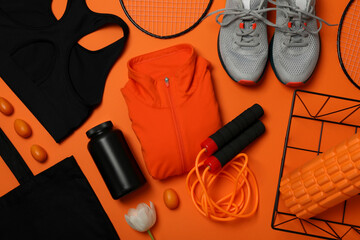Sportswear with flowers on an orange background.
