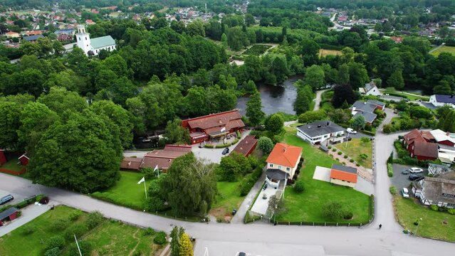 Laxens hus by the Morrum River in tranquil Morrum town, Blekinge, showcasing the swedish countryside, houses and greenery, Aerial
