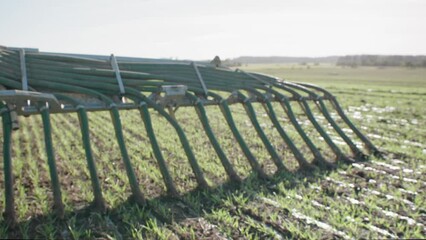 Liquid manure spreader releasing slurry on field