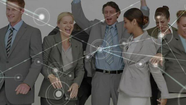 Animation of network over happy diverse business people bound and freeing themselves