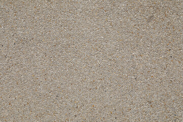 Beige colored Terrazzo seamless wall. Gravel floor texture and background