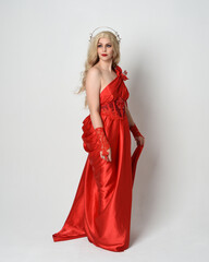 Full length portrait of  blonde model dressed as ancient mythological fantasy goddess in flowing...