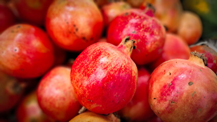 fresh and raw Pomegranates. bunch of Pomegranate French: grenadier.
German: Granatapfel.
Spanish: granada.
Italian: melograno.
Portuguese: romã
Swedish: granatäpple.