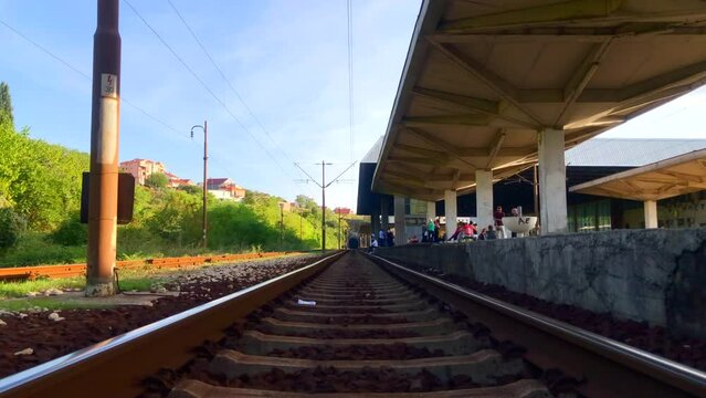 Looking down railroad tracks. Standing on train tracks. First person view of train tracks. Mostar, Bosnia and Herzegovina. Europe.