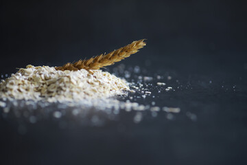 World grain crisis. A handful of cereals and on a dark background.