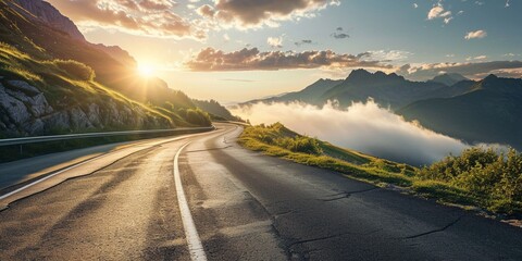 A highway that ascends into the clouds, with a view of mountain peaks and the sun rising above the horizon