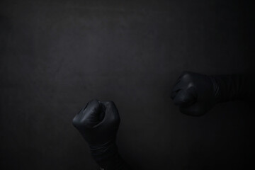 Background of hands in gloves. Black gloves. Hand gestures in black gloves. - obrazy, fototapety, plakaty