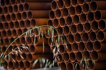 Pile of rusted steel pipes. selective focus