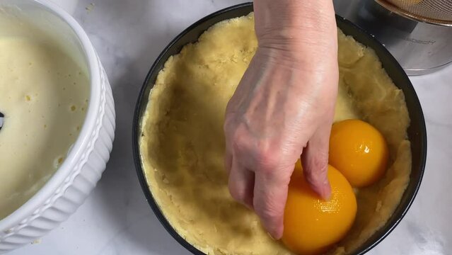 Placing fruits on a short crust cake base Making a peach pie