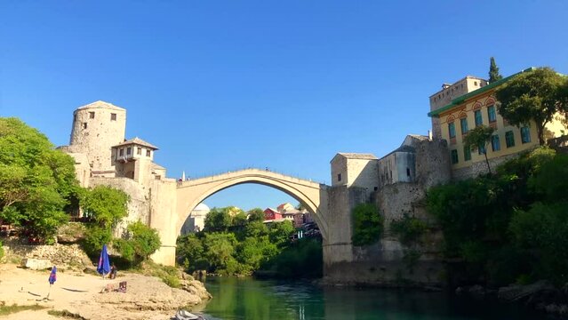 Bridge crossing river. Mostar bridge crossing the Neretva river. Old stone bridge. Stari Most. Mostar, Bosnia and Herzegovina. Europe.