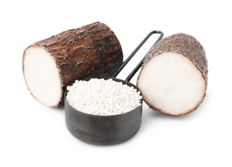 Scoop with tapioca pearls and cassava roots isolated on white