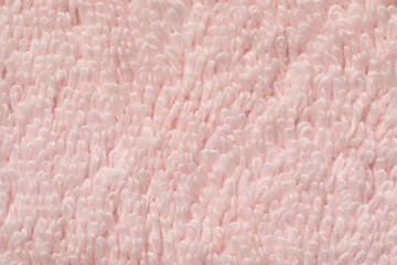 Texture of soft light pink fabric as background, top view
