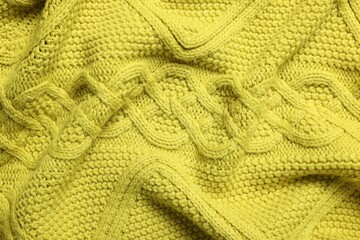 Texture of soft yellow fabric as background, top view