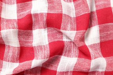 Texture of crumpled checkered fabric as background, top view