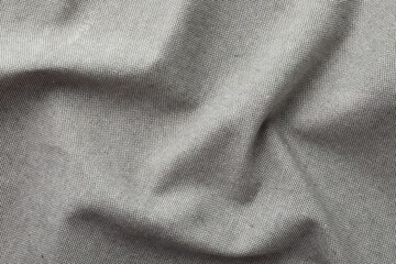 Texture of grey crumpled fabric as background, top view