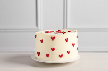 Bento cake with red hearts on white wooden table. St. Valentine's day surprise