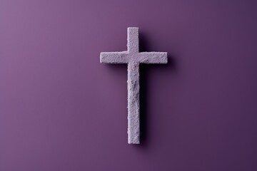 Simple stone cross on a purple background, symbolizing faith and solemnity - 734750493