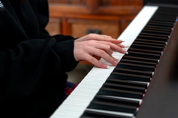 Fototapeta premium Girl playing the piano with polished nails