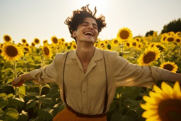 A non-binary individual, aged 27, of Middle Eastern descent, wearing a gender-neutral jumpsuit and accessorized with statement jewelry, their expression joyful and radiant as they dance in a sunflower - Powered by Adobe