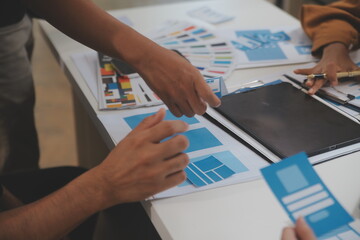 Close up ux developer and ui designer use augmented reality brainstorming about mobile app...