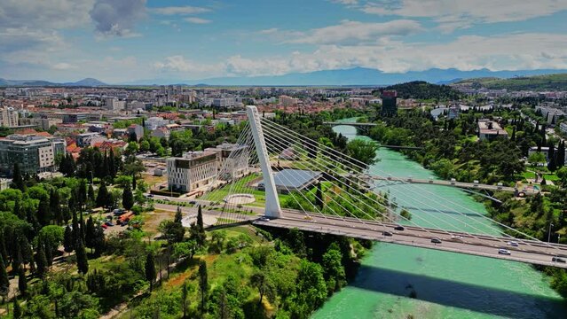 Aerial view of the cityscape of Podgorica behind the Millennium Bridge, a cable-stayed bridge over the Moracha. Montenegro