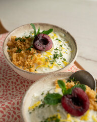 Yogurt and lemon mousse with cherries.