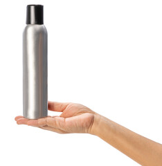 Female hand holding a spray can on white background, Silver perfume spray can or deodorizing spray...