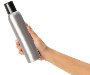 Female hand holding a spray can on white background, Silver perfume spray can or deodorizing spray...