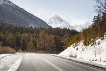 Fototapeta na wymiar Country road in winter mountains