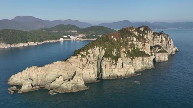 Aerial view of a famous rock island in South Korea called Haegumgang in autumn. Haegeumgang belongs to Hallyeo Marine National Park, which is assigned as an official green area.