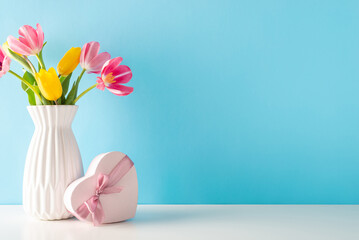 Mother's Day and 8 March theme: side view table features a heart-shaped present and a vase of...
