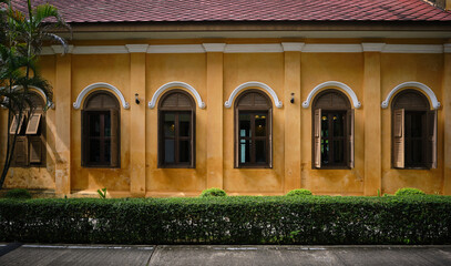 Graceful windows in the colonial arches style. Trang church, Thailand