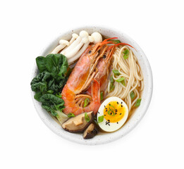Delicious ramen with shrimps and egg in bowl isolated on white, top view. Noodle soup